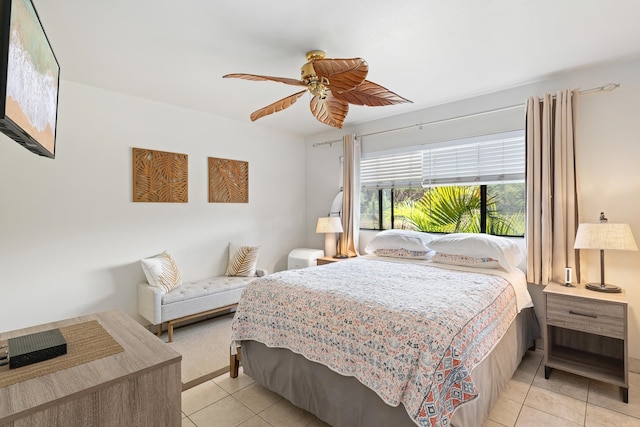 bedroom with ceiling fan and light tile patterned floors