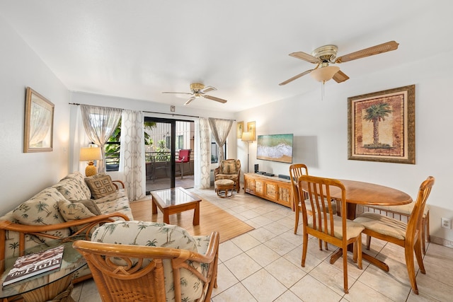 tiled living room with ceiling fan