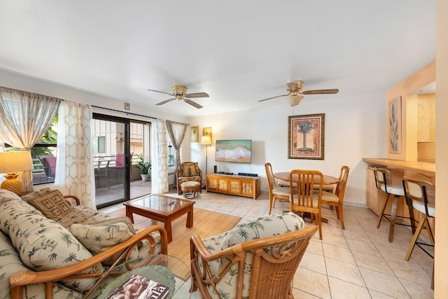 tiled living room with ceiling fan