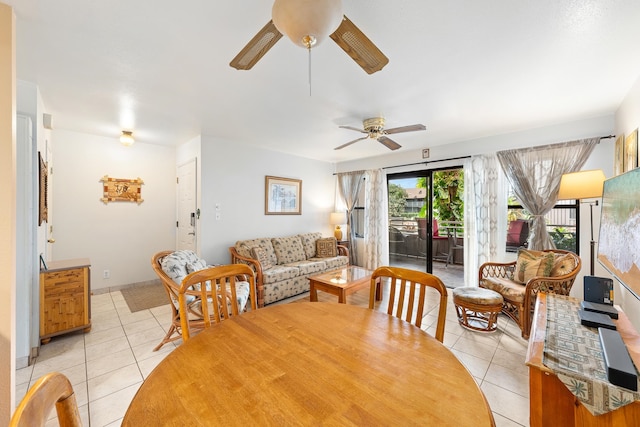 dining space featuring ceiling fan and light tile patterned flooring