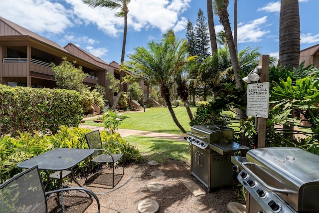 view of patio featuring grilling area and a balcony