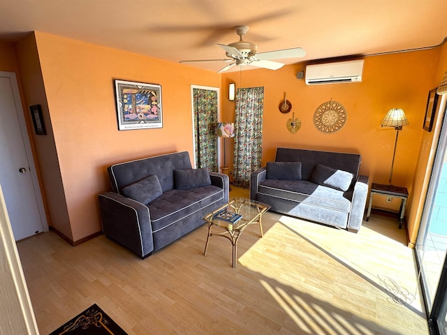 living room with an AC wall unit, ceiling fan, and light hardwood / wood-style floors