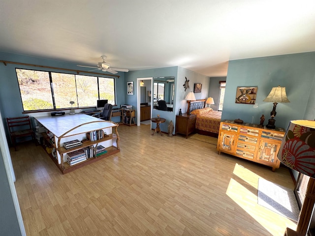 bedroom featuring ceiling fan and light wood-type flooring