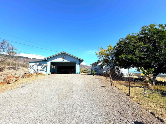 view of front of property with a mountain view