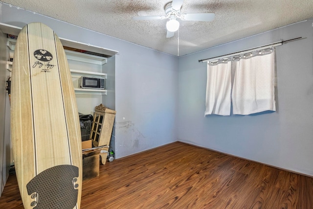 232 N Opio Pl Unit 232N, Opio Pl, Kihei, HI 96753 - unfurnished room featuring a textured ceiling, ceiling fan, and wood finished floors