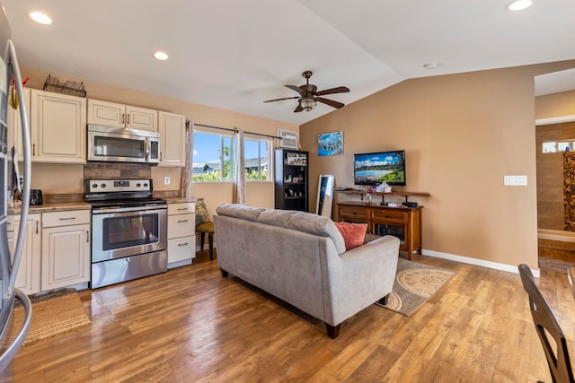 232 N Opio Pl Unit 232N, Opio Pl, Kihei, HI 96753 - living area featuring a ceiling fan, vaulted ceiling, light wood finished floors, and recessed lighting