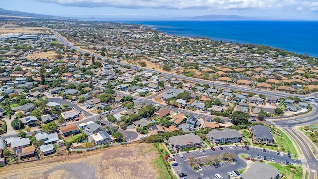 232 N Opio Pl Unit 232N, Opio Pl, Kihei, HI 96753 - aerial view of property and surrounding area featuring a nearby body of water and nearby suburban area