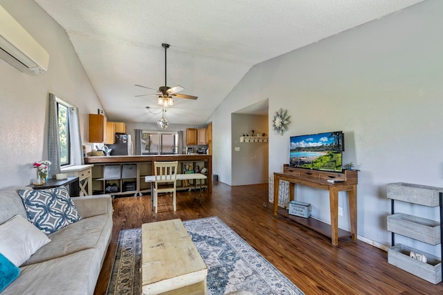 232 N Opio Pl Unit 232N, Opio Pl, Kihei, HI 96753 - living area featuring an AC wall unit, dark wood-style flooring, ceiling fan, and lofted ceiling