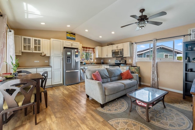 232 N Opio Pl Unit 232N, Opio Pl, Kihei, HI 96753 - living room featuring light wood finished floors, vaulted ceiling, healthy amount of natural light, ceiling fan, and recessed lighting