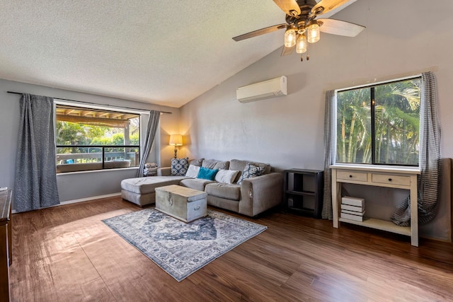 232 N Opio Pl Unit 232N, Opio Pl, Kihei, HI 96753 - living area featuring a wall mounted AC, vaulted ceiling, wood finished floors, ceiling fan, and a textured ceiling