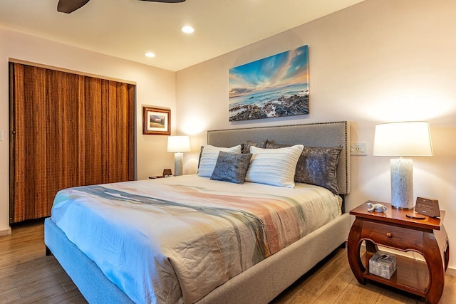 bedroom featuring hardwood / wood-style floors and ceiling fan