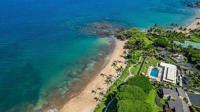 drone / aerial view featuring a beach view and a water view