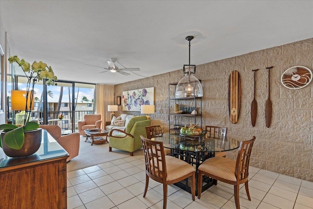 dining space with light tile floors and ceiling fan