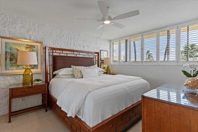 bedroom with light colored carpet and ceiling fan