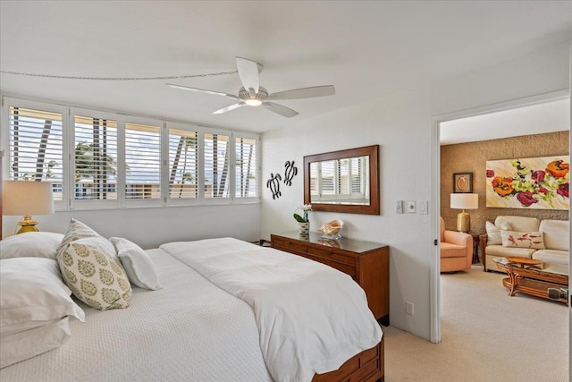 bedroom with light colored carpet and ceiling fan