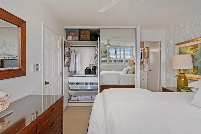 carpeted bedroom with a closet and ceiling fan