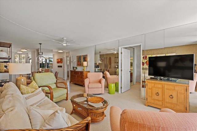 carpeted living room featuring ceiling fan