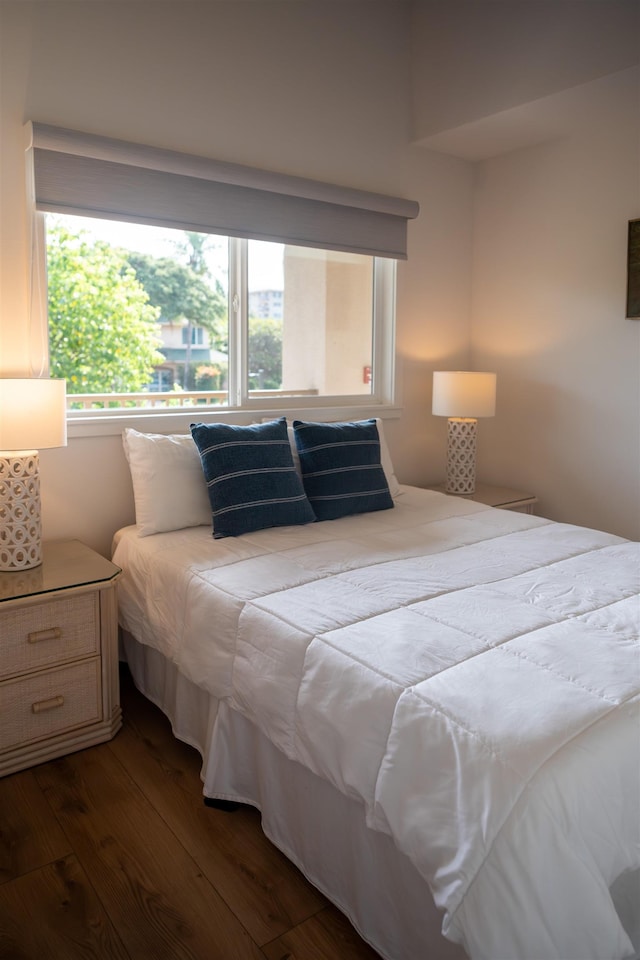 bedroom featuring dark wood finished floors