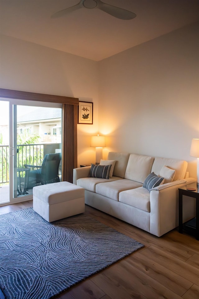 living area with wood finished floors and ceiling fan