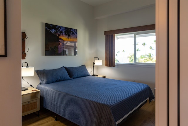 bedroom with wood finished floors