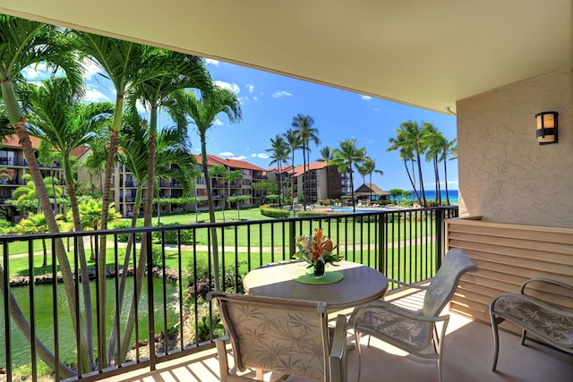 balcony featuring a water view