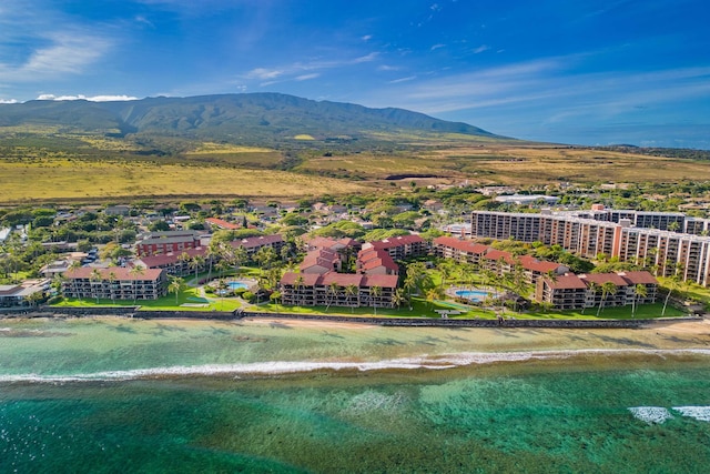 birds eye view of property featuring a mountain view