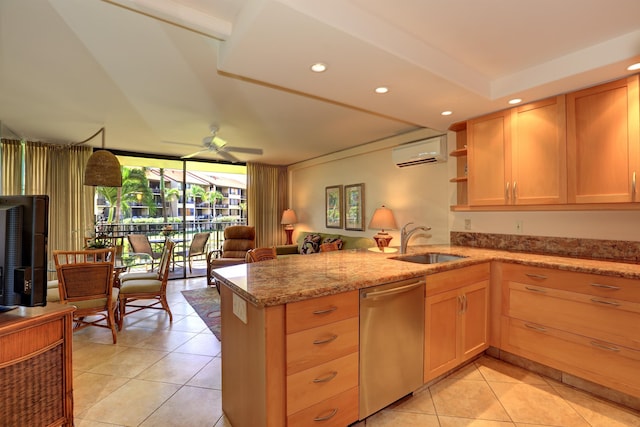 kitchen featuring ceiling fan, dishwasher, sink, and kitchen peninsula