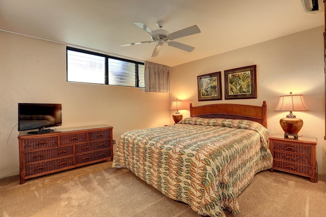 bedroom with light carpet and ceiling fan