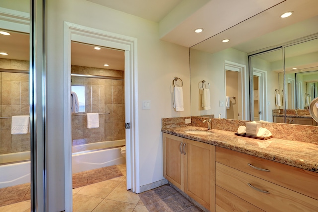 full bathroom with vanity, toilet, tile patterned floors, and combined bath / shower with glass door