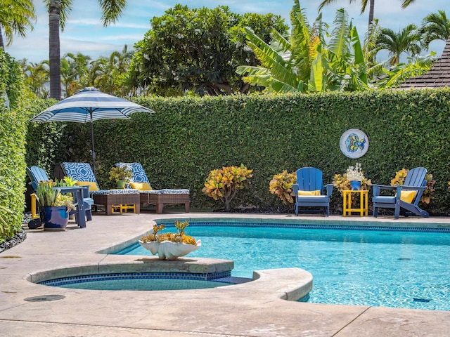 view of swimming pool featuring a patio