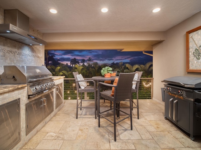 view of patio featuring an outdoor kitchen and area for grilling