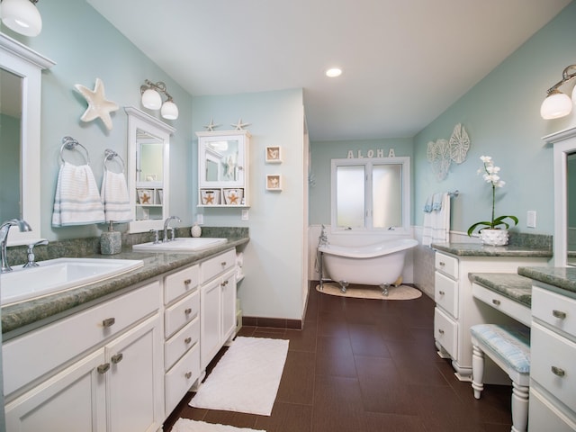 bathroom with vanity, a bath, and tile patterned flooring