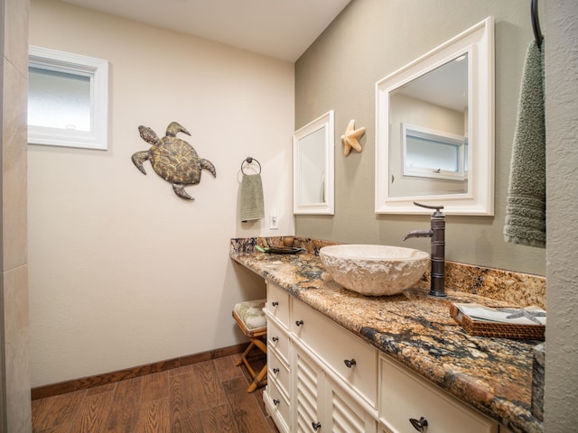 bathroom with vanity and hardwood / wood-style floors