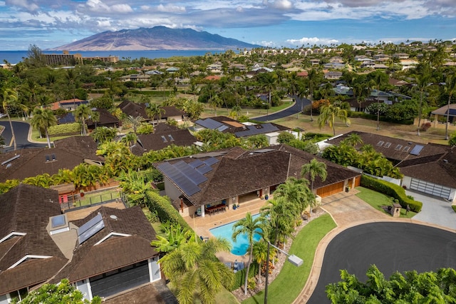 birds eye view of property with a mountain view