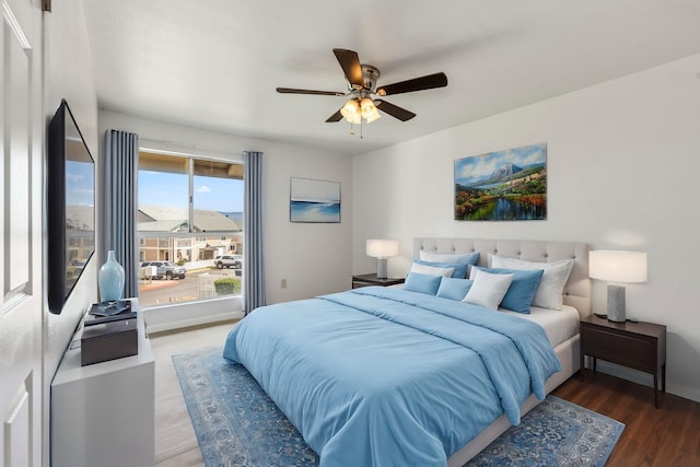 bedroom featuring dark hardwood / wood-style floors and ceiling fan