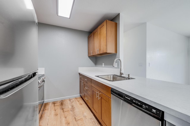 480 Kenolio Rd Unit 22-105, Kihei, HI 96753 - kitchen with stainless steel appliances, light wood-type flooring, light countertops, and brown cabinets