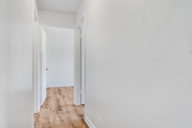 480 Kenolio Rd Unit 22-105, Kihei, HI 96753 - hall featuring light wood-style flooring and baseboards