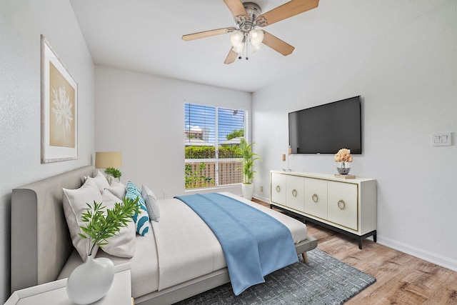 480 Kenolio Rd Unit 22-105, Kihei, HI 96753 - bedroom featuring wood finished floors and a ceiling fan