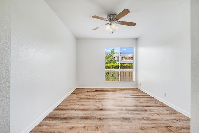 480 Kenolio Rd Unit 22-105, Kihei, HI 96753 - empty room with wood finished floors and a ceiling fan