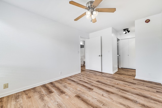 480 Kenolio Rd Unit 22-105, Kihei, HI 96753 - unfurnished bedroom featuring wood finished floors and ceiling fan