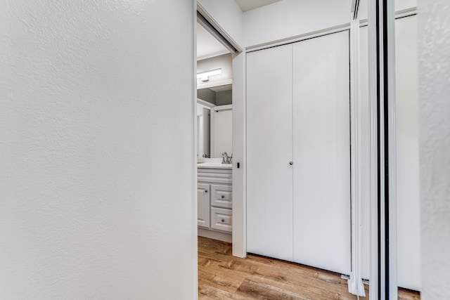 480 Kenolio Rd Unit 22-105, Kihei, HI 96753 - hall with light wood finished floors and a sink