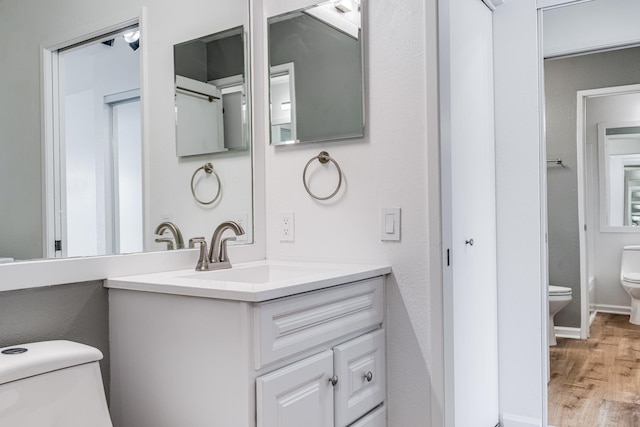 480 Kenolio Rd Unit 22-105, Kihei, HI 96753 - bathroom featuring vanity and wood finished floors