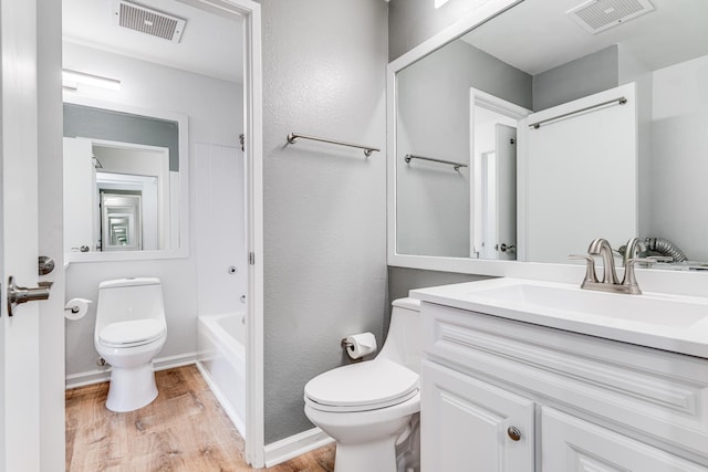 480 Kenolio Rd Unit 22-105, Kihei, HI 96753 - bathroom featuring wood finished floors, vanity, and  shower combination