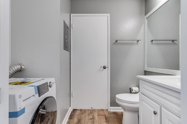 480 Kenolio Rd Unit 22-105, Kihei, HI 96753 - half bath featuring washer / clothes dryer, vanity, wood finished floors, and electric panel