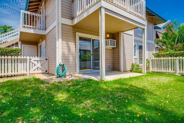 480 Kenolio Rd Unit 22-105, Kihei, HI 96753 - entrance to property featuring a balcony, a patio, and a wall unit AC