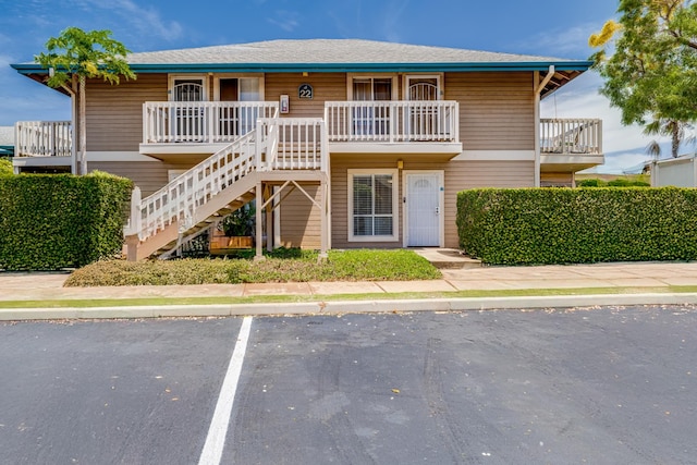 480 Kenolio Rd Unit 22-105, Kihei, HI 96753 - view of property with stairs and uncovered parking