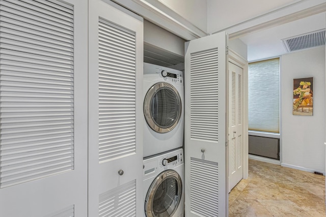 500 Bay Dr Unit 12G4, Lahaina, HI 96761 - laundry room with stacked washer / dryer and baseboards