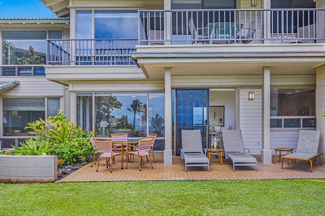 500 Bay Dr Unit 12G4, Lahaina, HI 96761 - rear view of house with a balcony, a patio, and a lawn