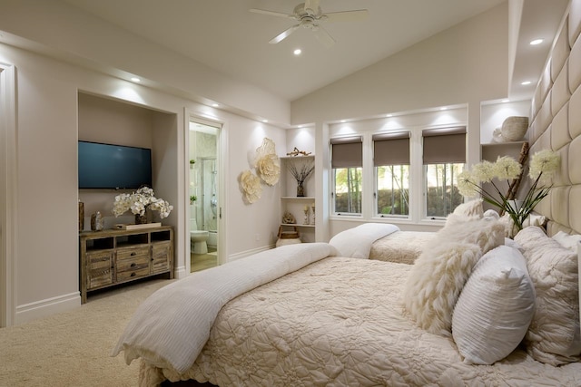 carpeted bedroom featuring ensuite bath, ceiling fan, and high vaulted ceiling