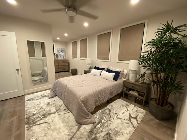 bedroom featuring ceiling fan and hardwood / wood-style floors